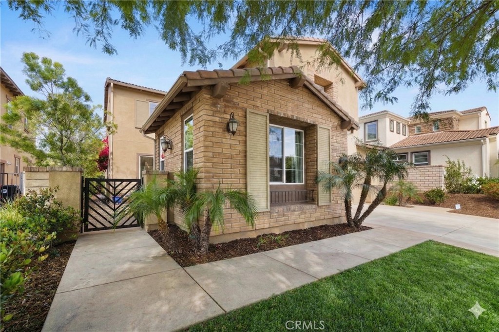 28613 Stonegate Court Valencia, CA 91354 - Photo 3 of 56 a front view of a house with a yard