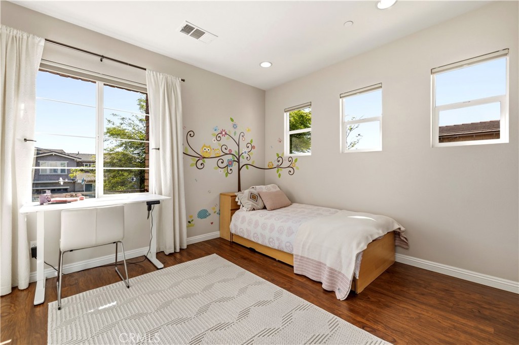 28613 Stonegate Court Valencia, CA 91354 - Photo 31 of 56 a bedroom with a bed and a large window