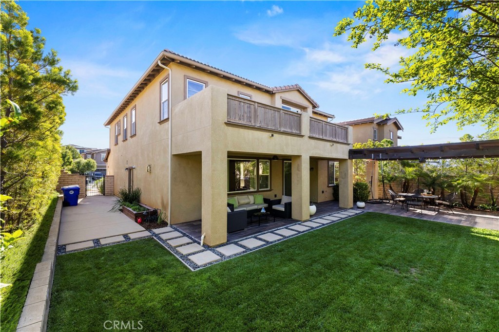28613 Stonegate Court Valencia, CA 91354 - Photo 39 of 56 a view of a house with a yard porch and sitting area
