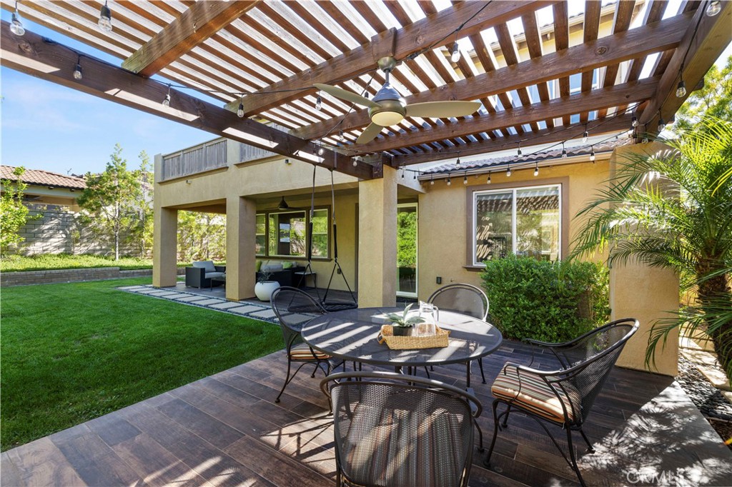 28613 Stonegate Court Valencia, CA 91354 - Photo 40 of 56 a view of a patio with table and chairs and potted plants