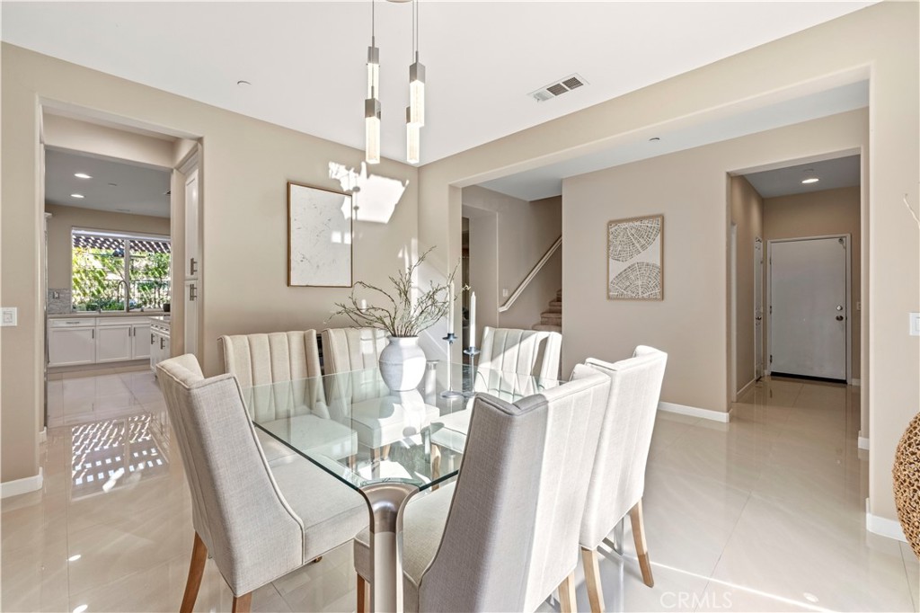 28613 Stonegate Court Valencia, CA 91354 - Photo 8 of 56 a view of a dining room with furniture and window