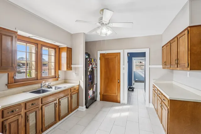 a spacious bathroom with a double vanity sink a mirror and a bathtub