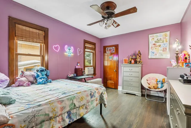 a bedroom with a bed a chandelier and a closet
