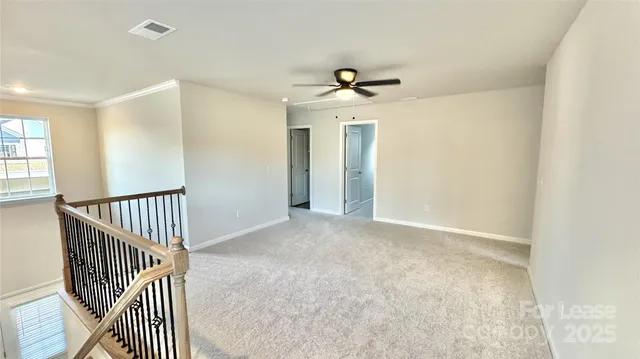 a view of a hallway with a chandelier