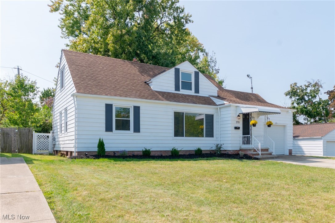 370 South Green Road Cleveland, OH 44121 - Photo 2 of 34 Cape cod-style house featuring a front lawn