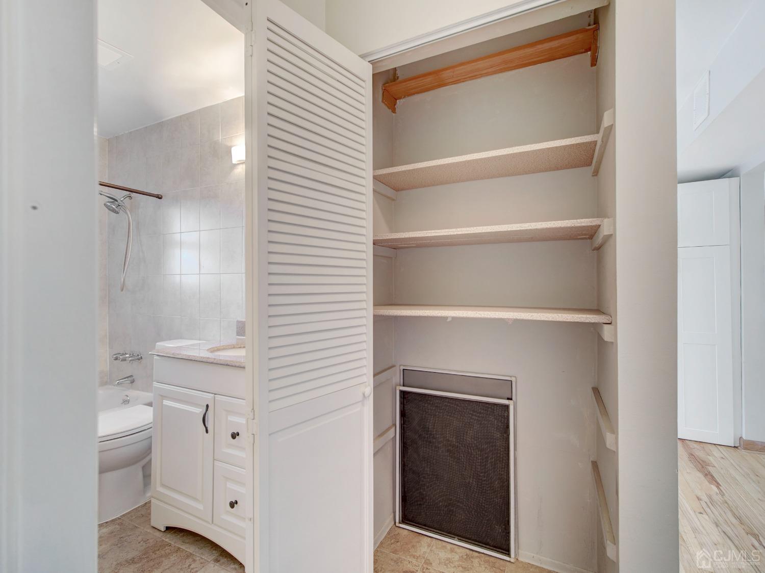 57 Judson Street, Unit 10B Edison, NJ 08837 - Photo 18 of 25 a bathroom with a sink a toilet and vanity