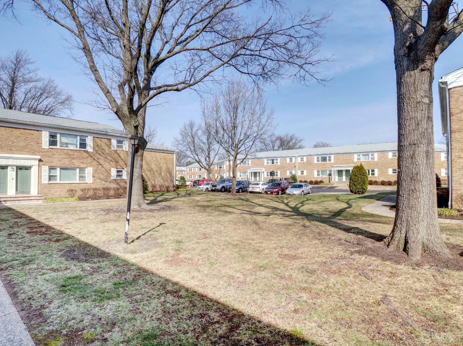 57 Judson Street, Unit 10B Edison, NJ 08837 - Photo 3 of 25 a view of outdoor space yard and tree