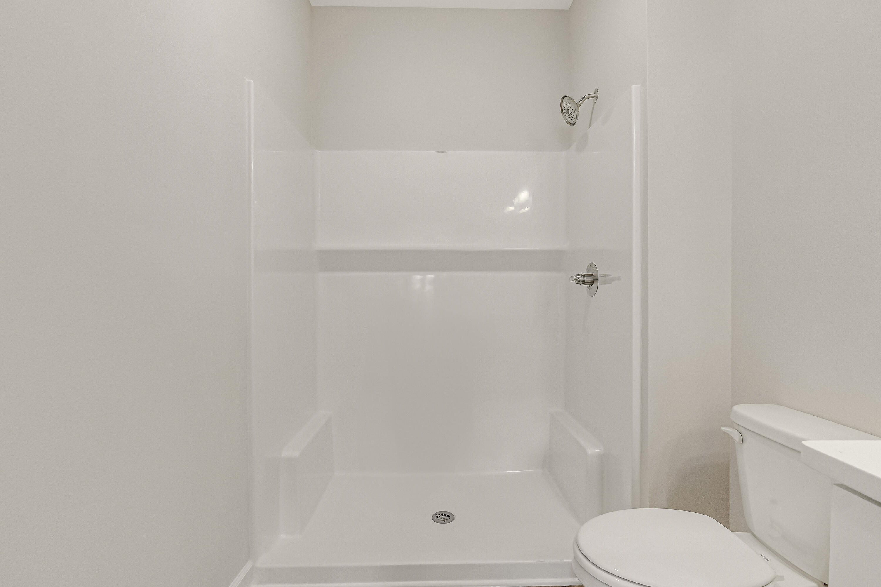 593 Brock Avenue Crestview, FL 32539 - Photo 13 of 19 a bathroom with a shower and a toilet