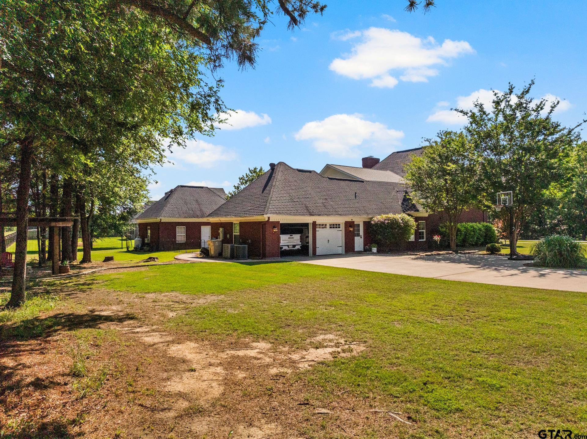 134 Private Road New Boston, TX 75570 - Photo 38 of 40 a front view of a house with garden