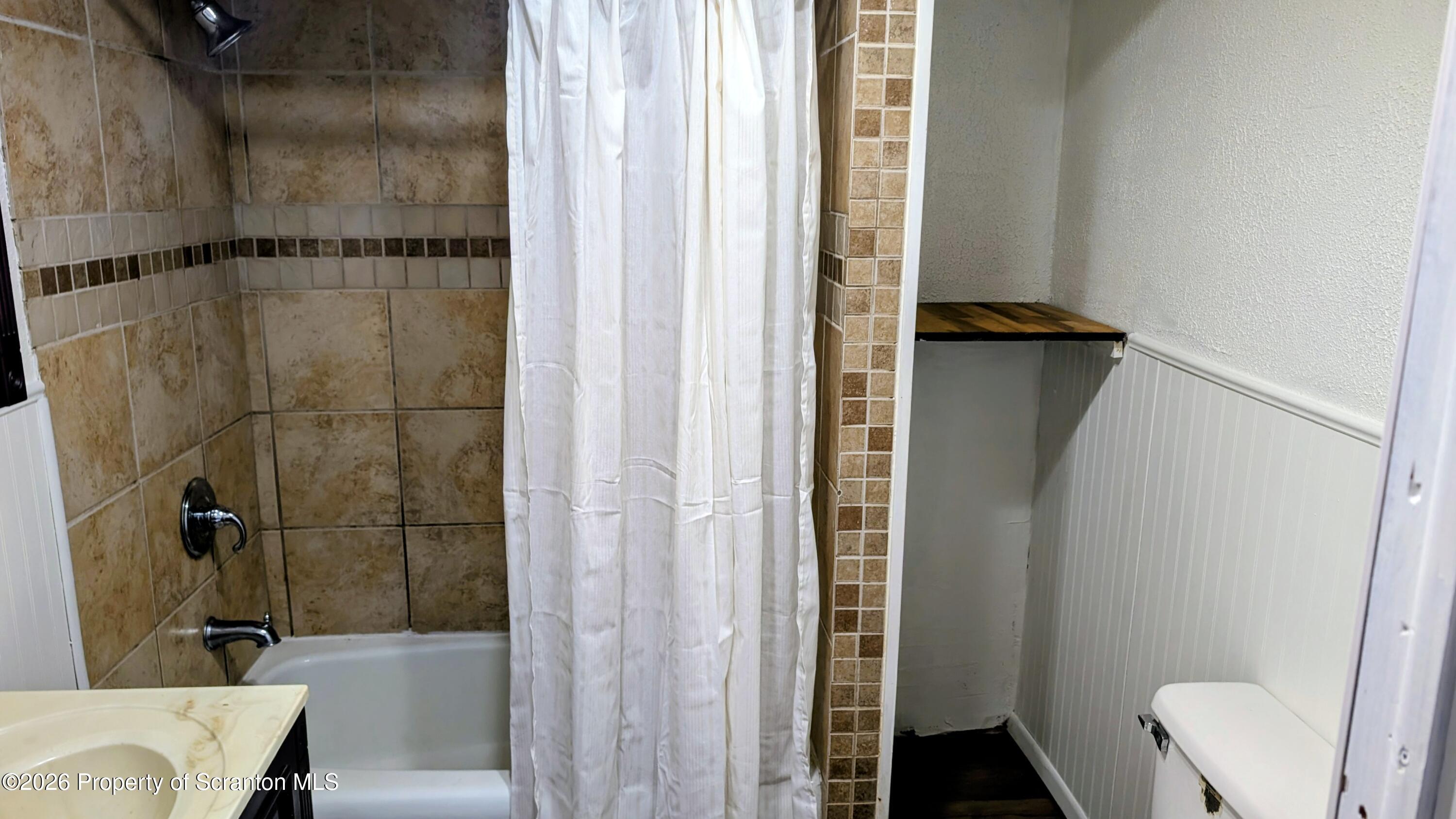 509 Main Street Duryea, PA 18642 - Photo 17 of 30 a bathroom with a shower and a toilet