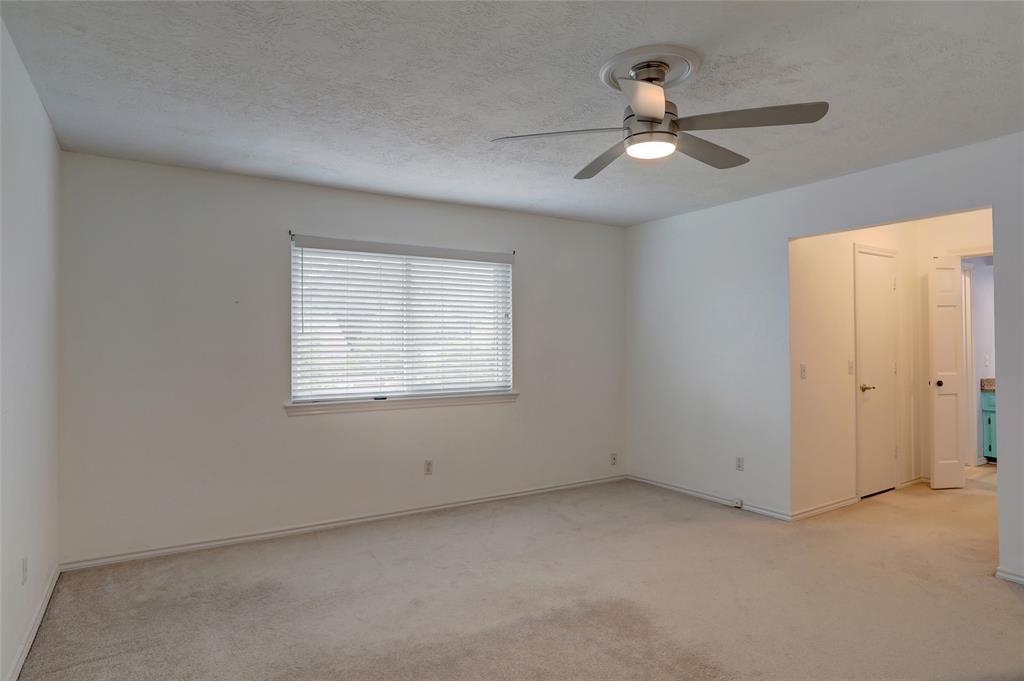 2102 Apollo Road Richardson, TX 75081 - Photo 14 of 26 Bright room featuring a window with horizontal blinds, carpet flooring, and a ceiling fan with integrated lighting