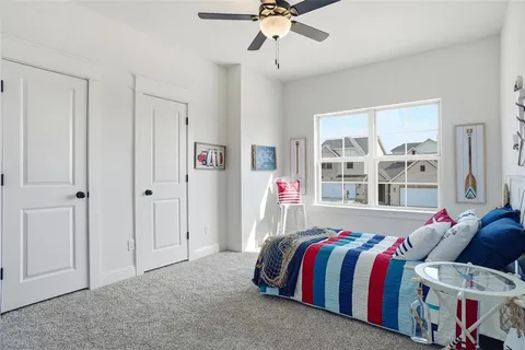 a bed room with a bed and a window