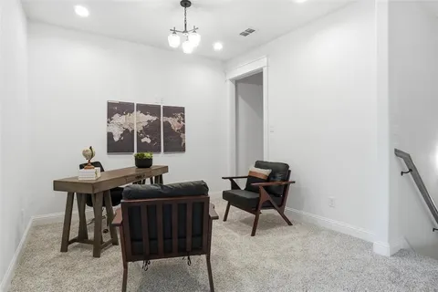 a view of a workspace with furniture