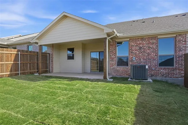 a view of a house with a yard and garage