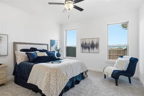 a bedroom with a bed and a couch