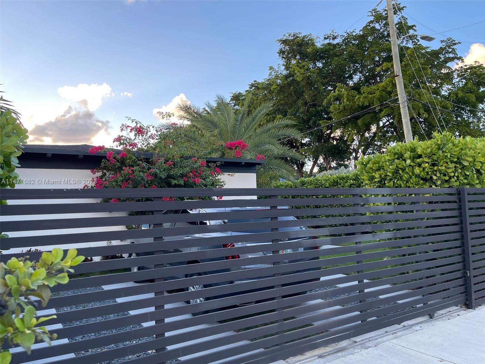 a potted plant sitting in front of a house