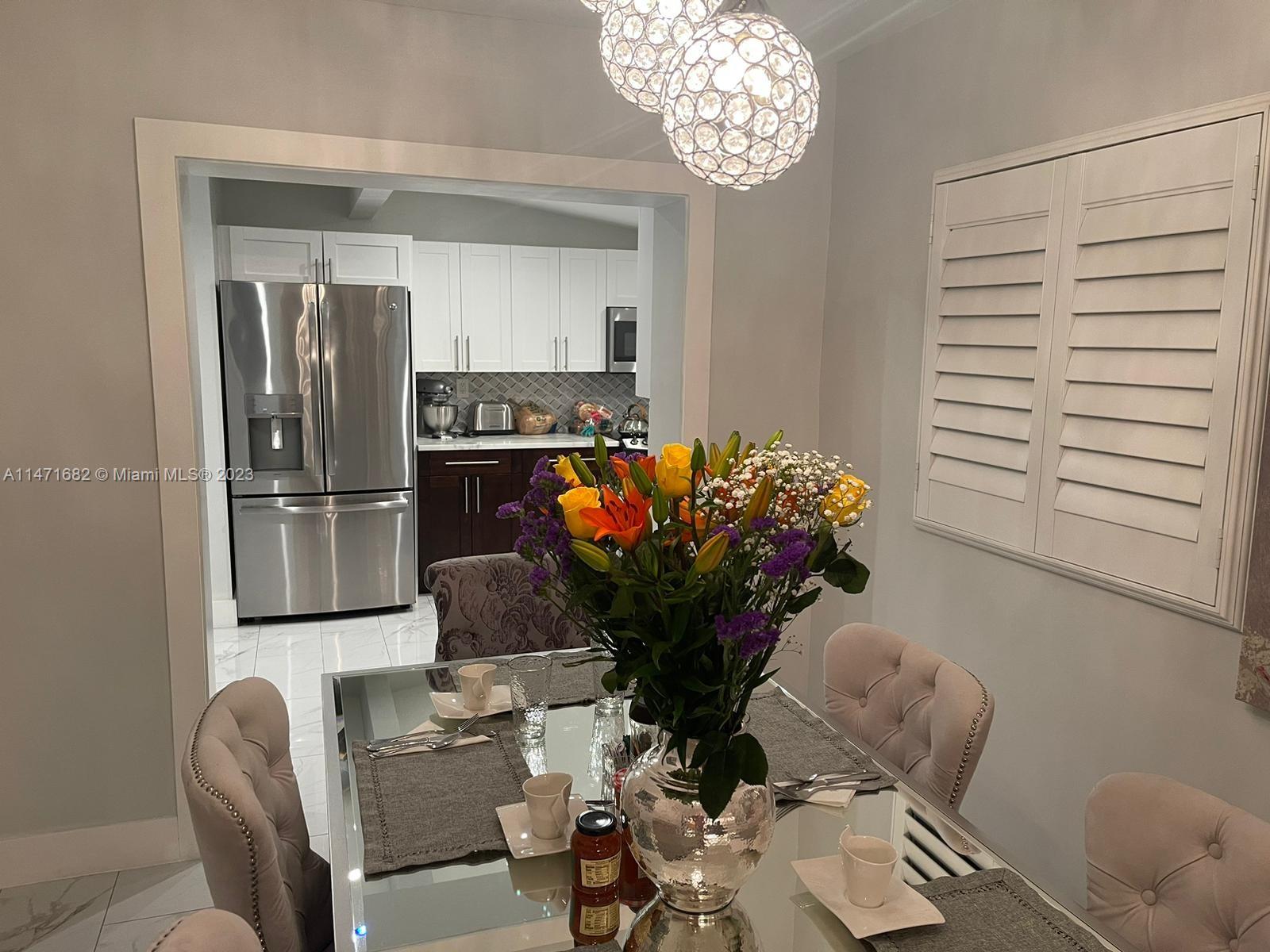 200 Southwest 30th Avenue Miami, FL 33135 - Photo 11 of 20 a living room with furniture flowerpot and a chandelier