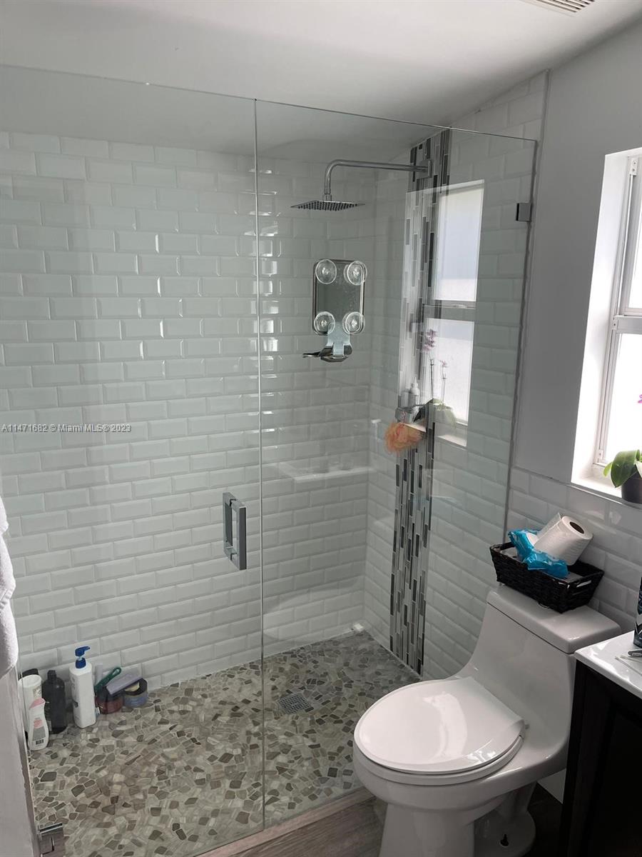 200 Southwest 30th Avenue Miami, FL 33135 - Photo 15 of 20 a bathroom with a toilet sink and shower