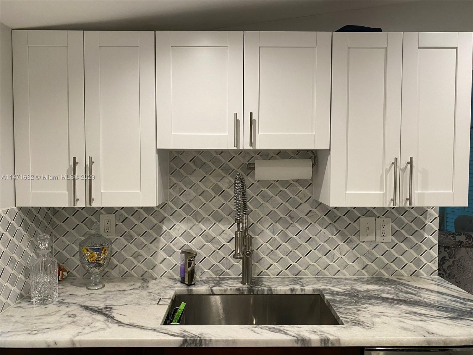 200 Southwest 30th Avenue Miami, FL 33135 - Photo 18 of 20 a view of kitchen with granite countertop white cabinets and a granite counter
