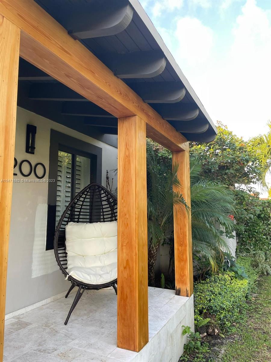 200 Southwest 30th Avenue Miami, FL 33135 - Photo 6 of 20 a view of porch with a table and chair