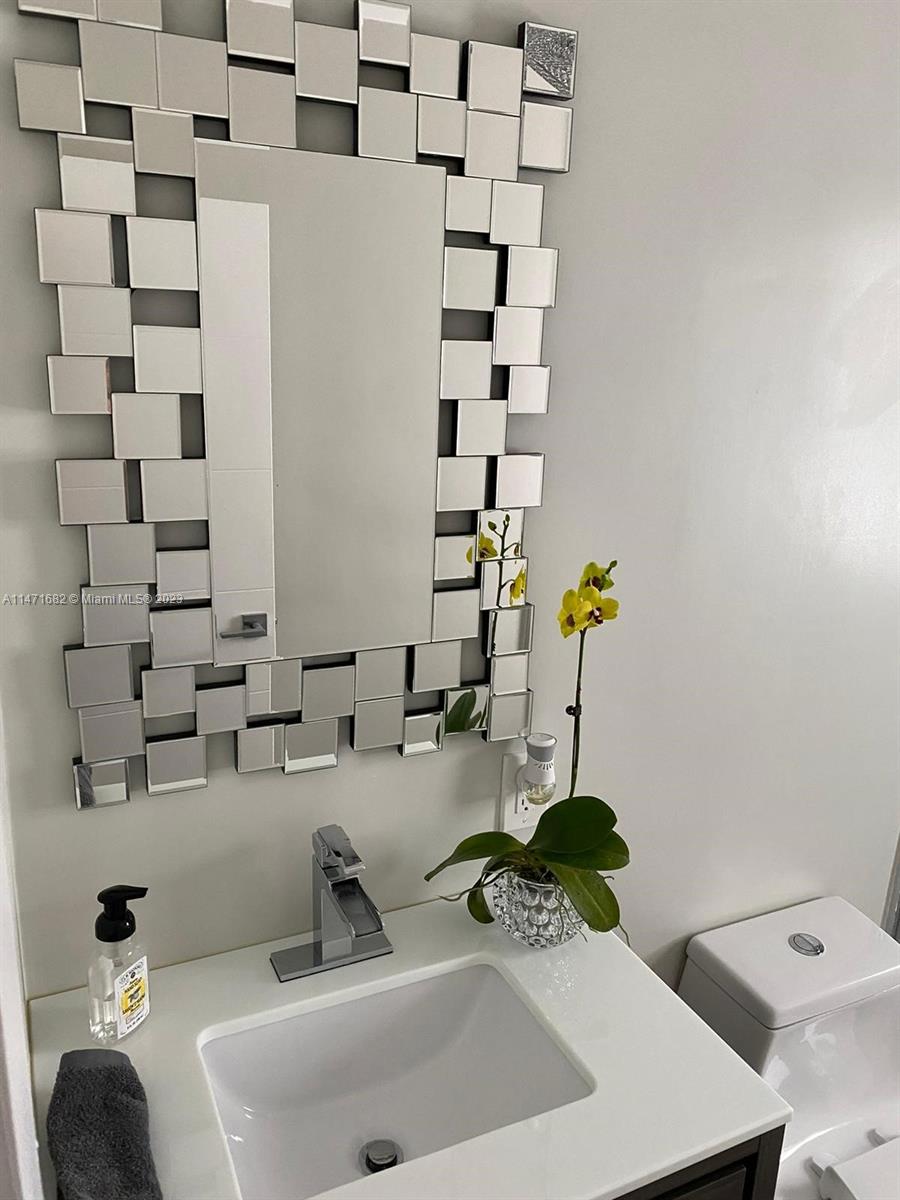 200 Southwest 30th Avenue Miami, FL 33135 - Photo 8 of 20 a bathroom with a sink a toilet and shower