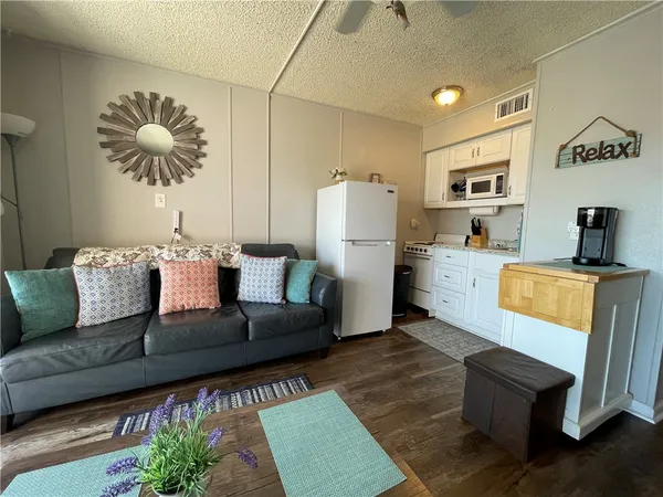 a living room with furniture and a couch