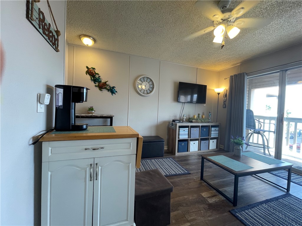 3938 Surfside Boulevard, Unit 3344 Corpus Christi, TX 78402 - Photo 10 of 34 a living room with furniture and a flat screen tv
