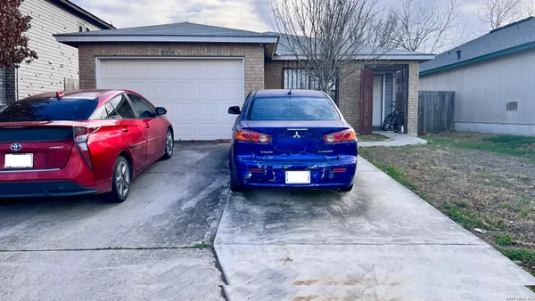 a car parked in front of a house