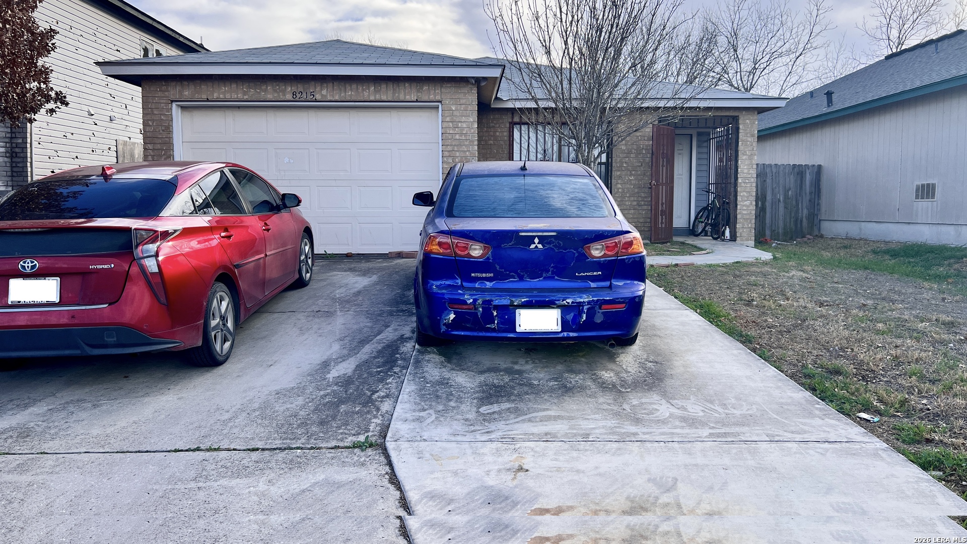 a car parked in front of a house