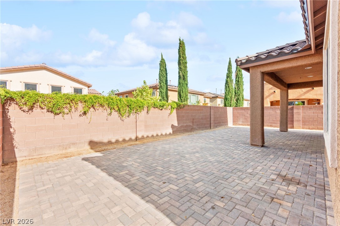 11048 Prairie Grove Road Las Vegas, NV 89179 - Photo 72 of 75 A spacious, paver-lined private yard awaits, perfect for outdoor enjoyment and relaxation.