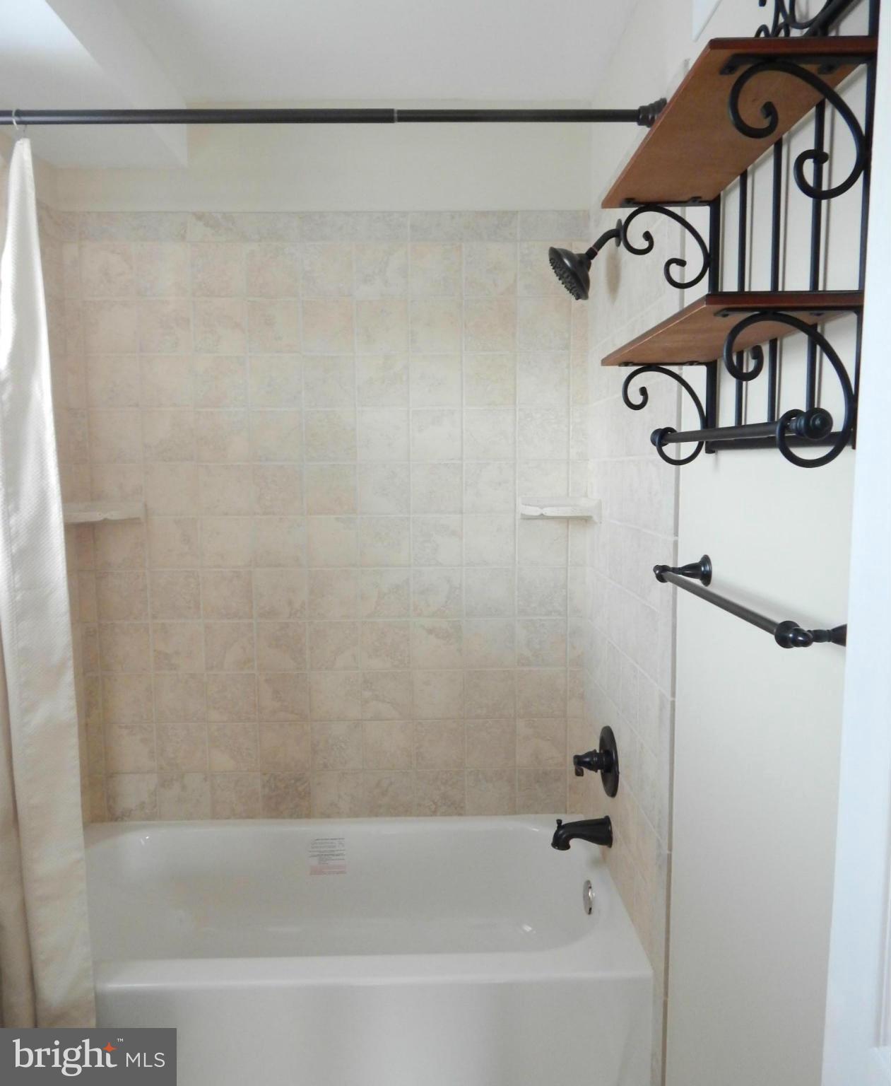 25 Kinship Road Dundalk, MD 21222 - Photo 11 of 30 a bathroom with a bathtub and shower
