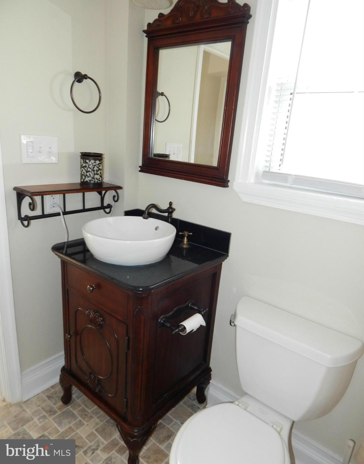 25 Kinship Road Dundalk, MD 21222 - Photo 12 of 30 a bathroom with a toilet sink and mirror