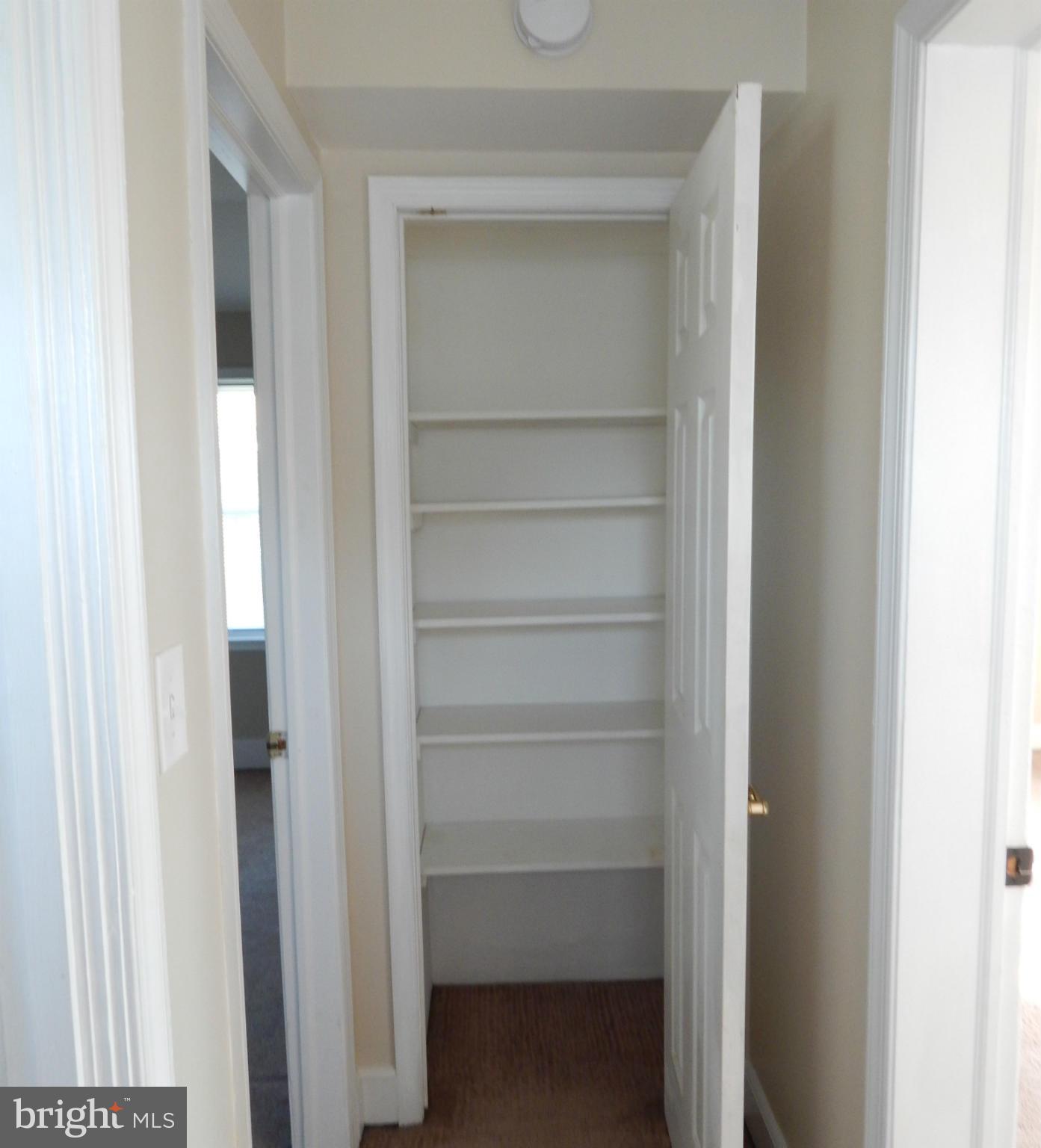 25 Kinship Road Dundalk, MD 21222 - Photo 14 of 30 a view of walk in closet with empty racks