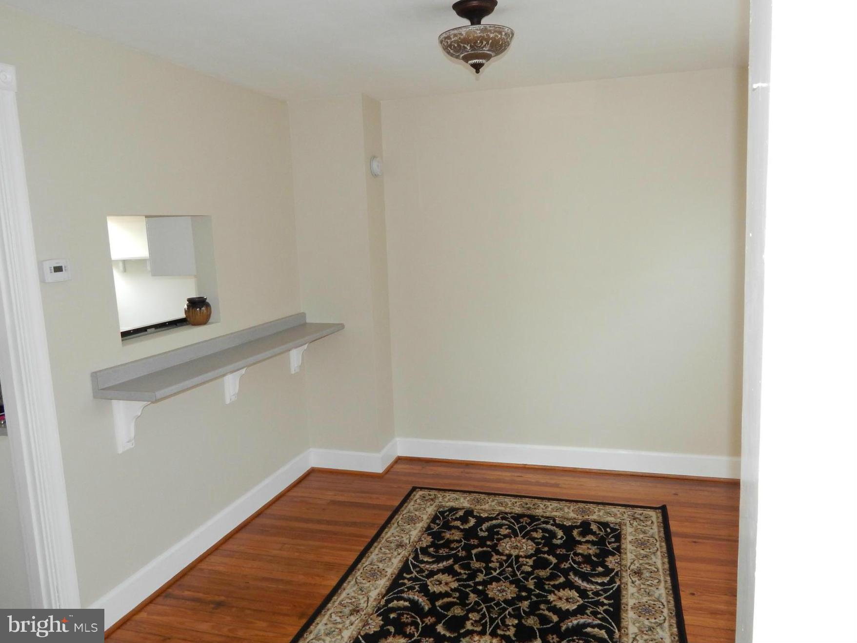 25 Kinship Road Dundalk, MD 21222 - Photo 4 of 30 a room with a rug and a wooden floor