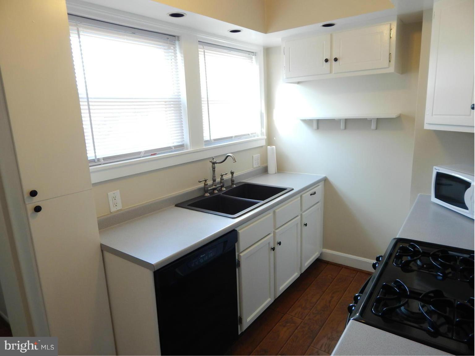 25 Kinship Road Dundalk, MD 21222 - Photo 5 of 30 a kitchen with sink refrigerator and window