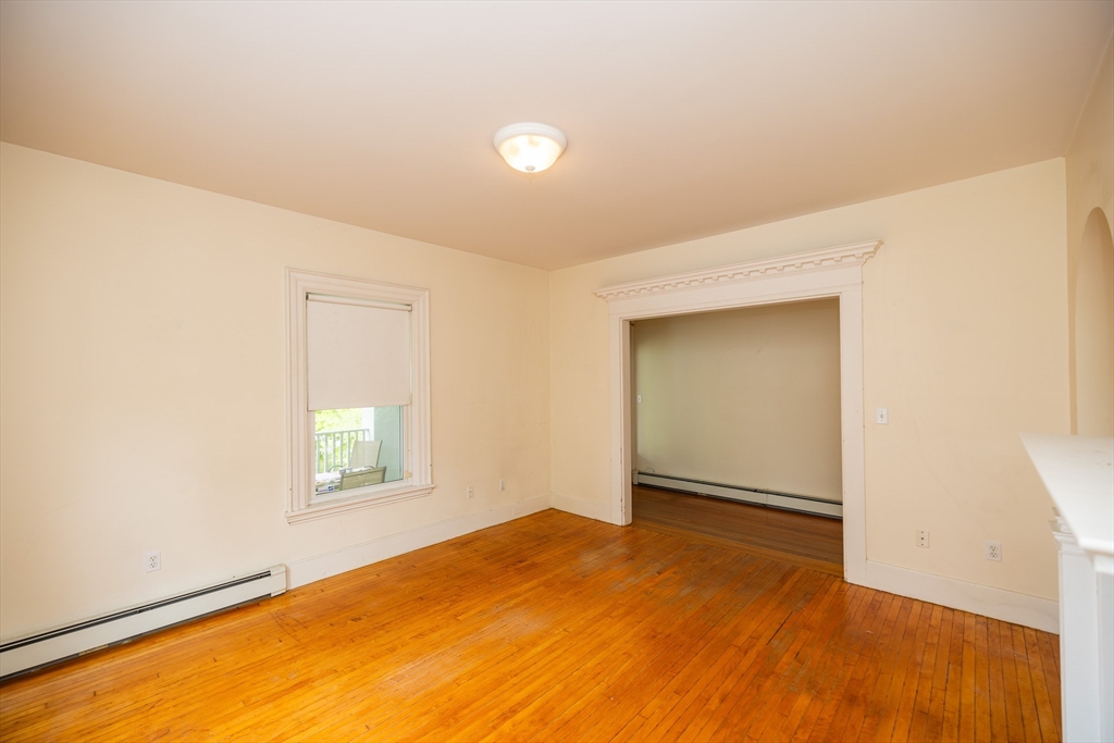 84 Walker Street, Unit 2 Newton, MA 02460 - Photo 16 of 18 a view of empty room with wooden floor