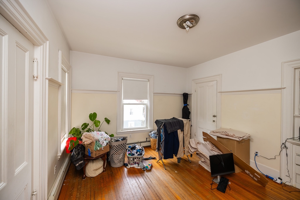 84 Walker Street, Unit 2 Newton, MA 02460 - Photo 3 of 18 a view of a workspace with furniture and a window