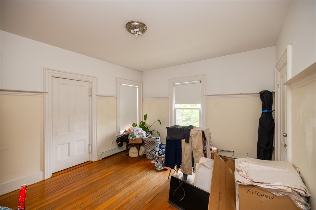 84 Walker Street, Unit 2 Newton, MA 02460 - Photo 4 of 18 a view of a workspace with furniture and a window