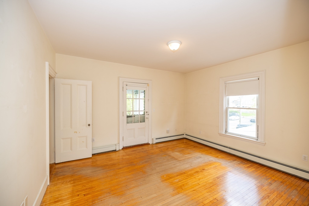84 Walker Street, Unit 2 Newton, MA 02460 - Photo 9 of 18 an empty room with windows