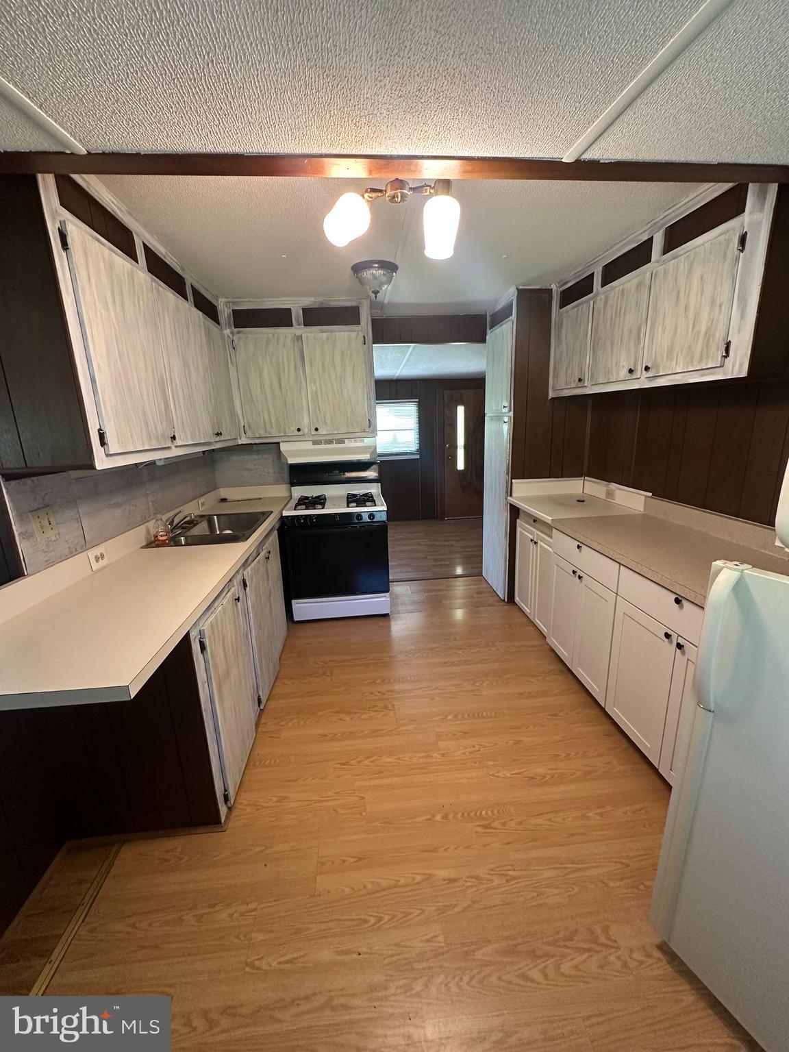 885 Liberty Furnace Road Edinburg, VA 22824 - Photo 5 of 10 a kitchen with stainless steel appliances granite countertop a stove a sink and a refrigerator