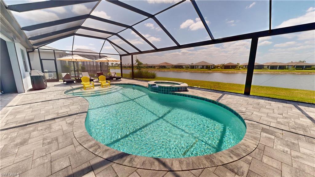 6162 Nobility Way Avenue Immokalee, FL 34142 - Photo 22 of 50 a view of a swimming pool with a patio