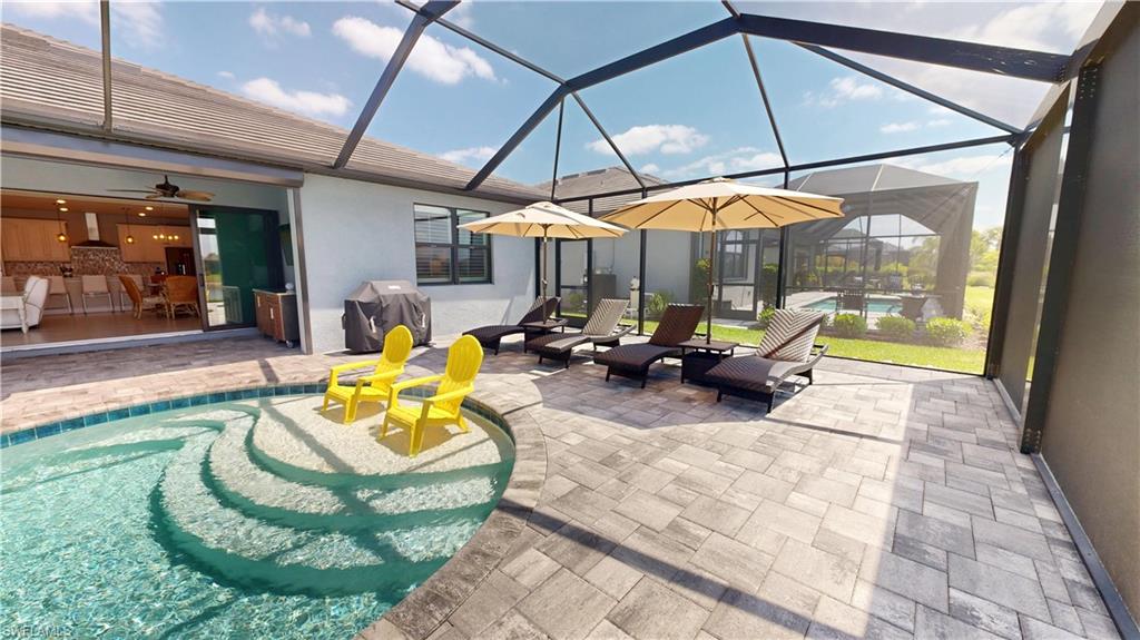 6162 Nobility Way Avenue Immokalee, FL 34142 - Photo 26 of 50 a view of a swimming pool with a patio