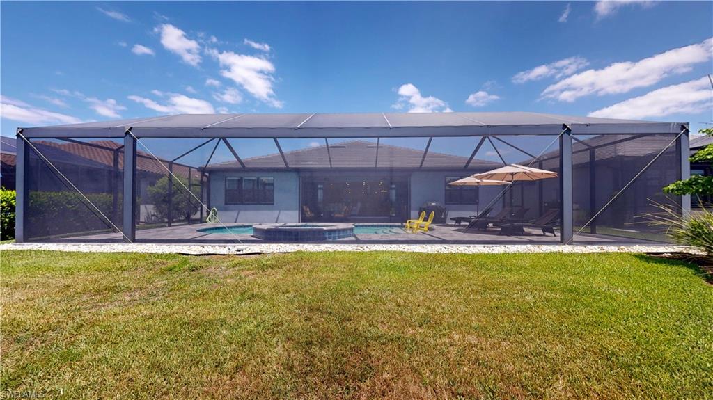 6162 Nobility Way Avenue Immokalee, FL 34142 - Photo 30 of 50 a swimming pool with table and chairs