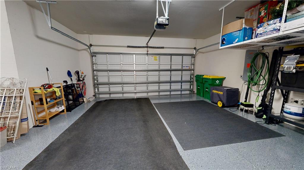 6162 Nobility Way Avenue Immokalee, FL 34142 - Photo 48 of 50 a view of a storage room with racks on the wall