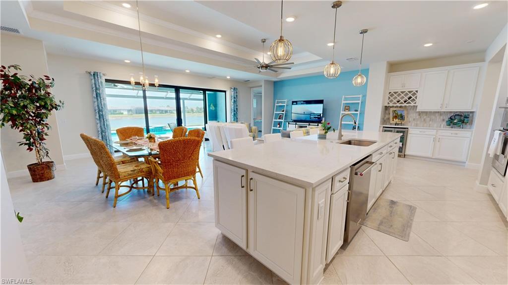 6162 Nobility Way Avenue Immokalee, FL 34142 - Photo 10 of 50 a large kitchen with a table and chairs
