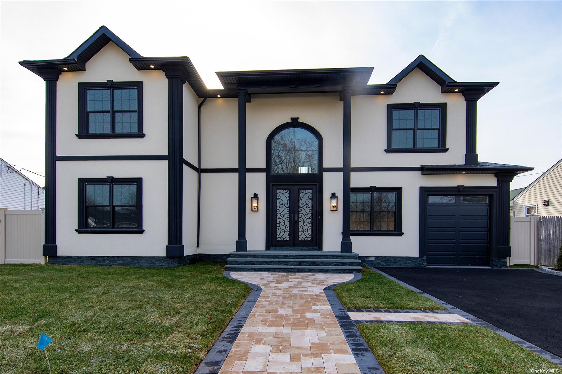a front view of a house with garden