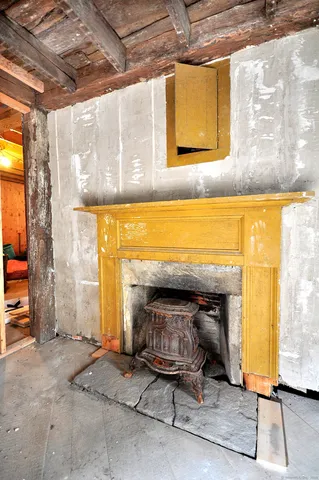 a living room with fireplace windows and a table