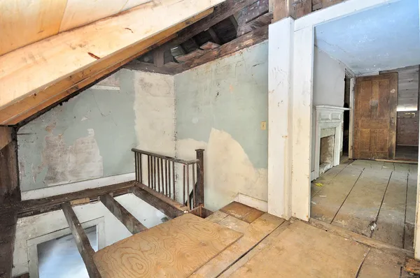 a view of empty room with a fireplace