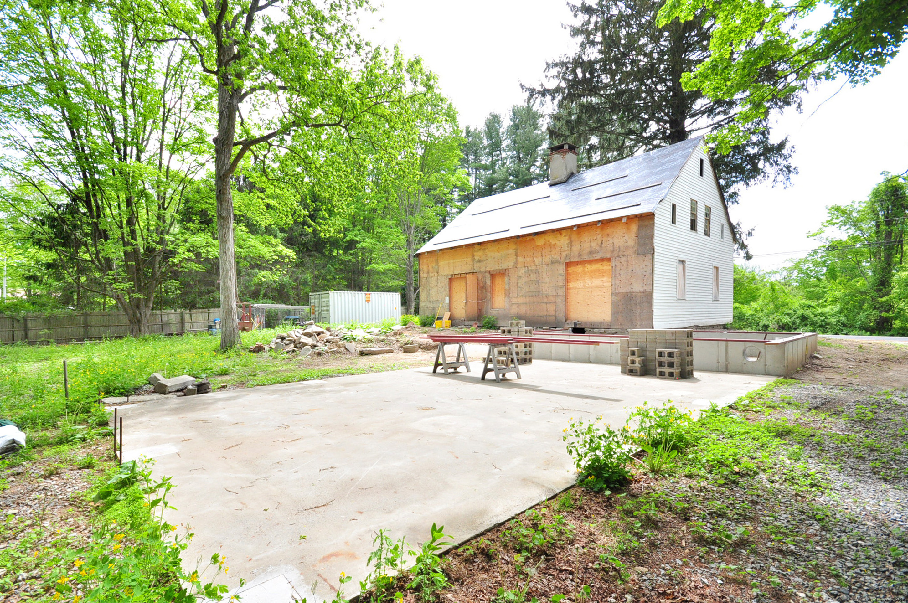 30 Chestnut Hill Road Killingworth, CT 06419 - Photo 7 of 38 a view of a patio with table and chairs under an umbrella