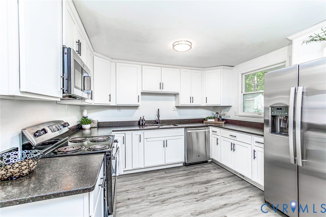 9406 Kendrick Road Chesterfield, VA 23236 - Photo 6 of 15 White cabinetry, dark countertops, stainless steel